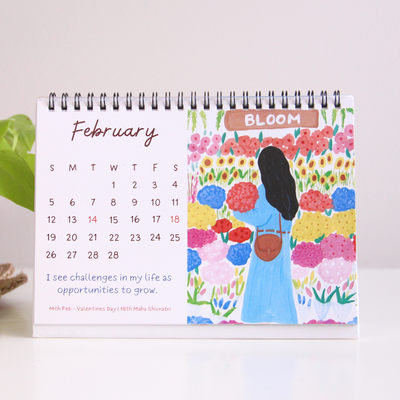 The affirmations calendar opened at the month of February. A hand painted illustration and the affirmation: 'I see challenges in my life as an opportunity to grow.'